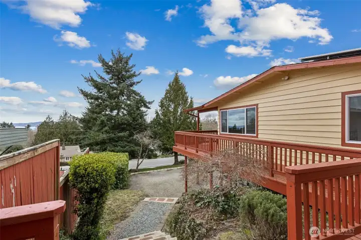 Large wrap-around entertainment deck with views of Puget Sound and the Olympic Mountains in Des Moines, WA.