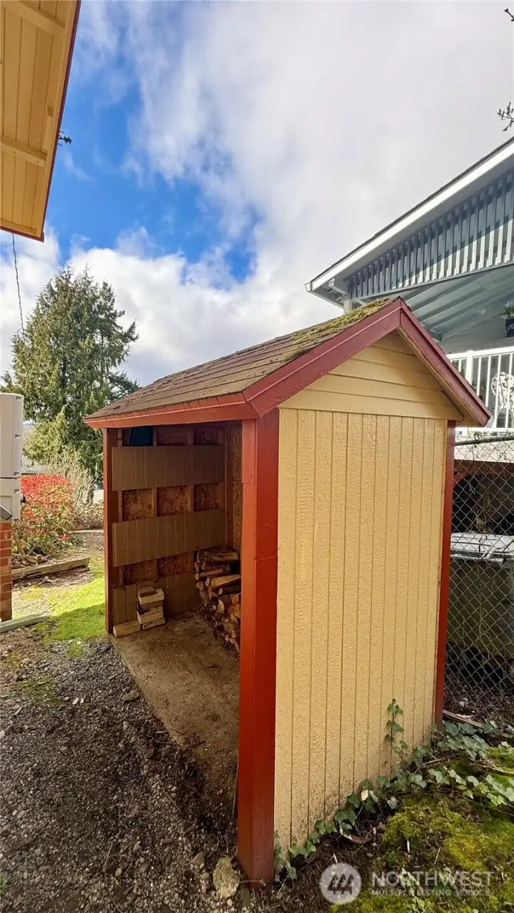 Wood shed on the North side of the home.