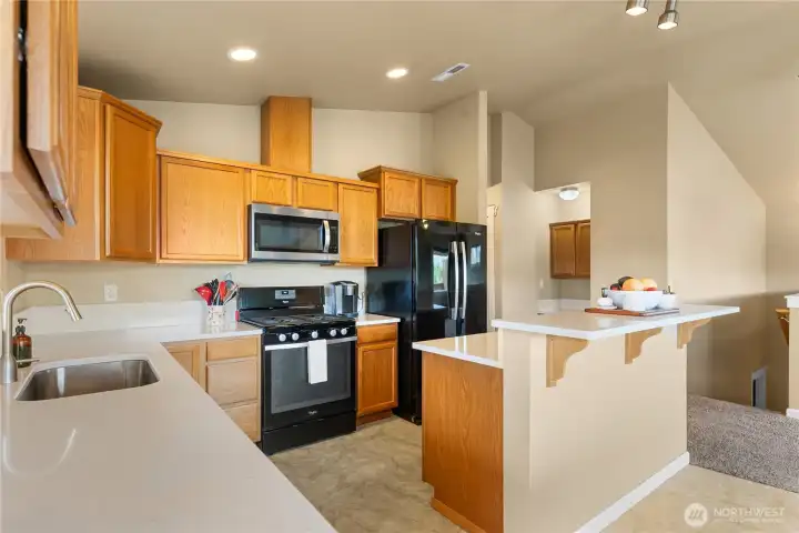 Kitchen with newly added Quartz countertops and tile flooring