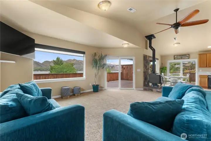 Living room adjacent the kitchen with access to the deck through slider with Lakeview.