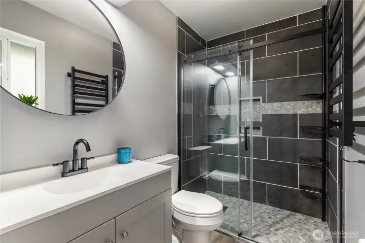 Beautiful walk-in tile shower in the primary bath