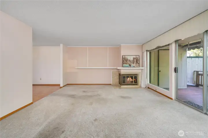 Another angle of the living room. The dining room is on the left and the deck has a private storage unit.