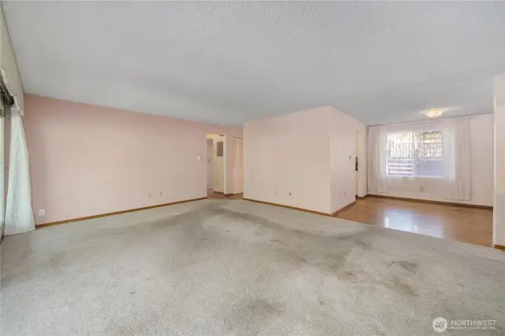 Efficient floor plan has a central kitchen with seamless flow into the dining and living rooms.
