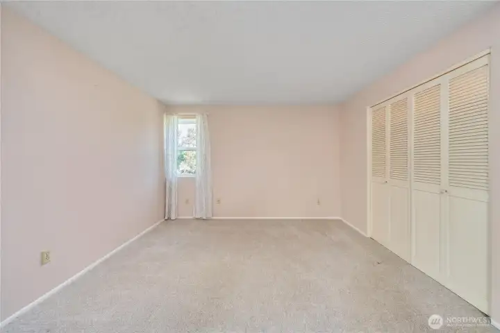 Primary suite includes good-sized bedroom, lots of closets, and private 3/4 bath.