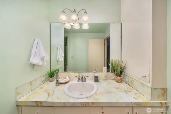 Built-in medicine cabinet on the side is a classic touch.