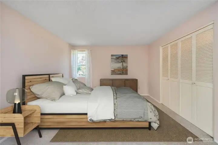 virtually staged primary bedroom.