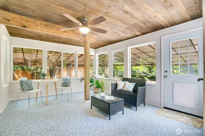 The sunporch—connected to the dining room and the wraparound deck—is a lovely, transitional space between the indoors and outdoors. The sunporch—connected to the dining room and the wraparound deck—is a lovely, transitional space between the indoors and outdoors.