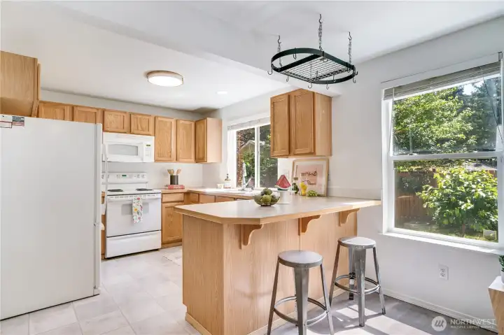 From the dining room, easily reach the kitchen with its bar counter for quick snacks for chats with the cook. From the dining room, easily reach the kitchen with its bar counter for quick snacks for chats with the cook.
