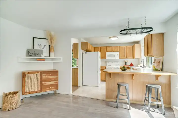 The bar counter connects the kitchen's eating area to the family room. Remember, this house has a heat pump for energy efficient A/C to keep you comfortable year round. The bar counter connects the kitchen's eating area to the family room. Remember, this house has a heat pump for energy efficient A/C to keep you comfortable year round.