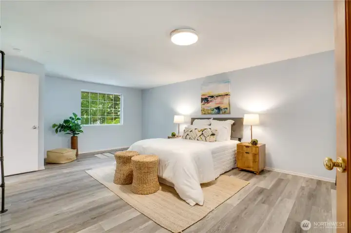 The private primary suite includes this spacious bedroom, a dressing room, walk-in closet, full bath, and an enclosed porch. The private primary suite includes this spacious bedroom, a dressing room, walk-in closet, full bath, and an enclosed porch.