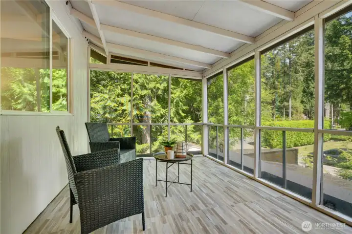 The screened porch might become one of your favorite places to sit. The rain stays out but the birdsong comes in. The screened porch might become one of your favorite places to sit. The rain stays out but the birdsong comes in.