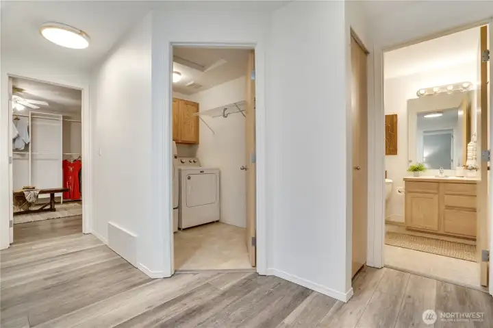 The upper landing is brightened by overhead lighting and a sun tunnel skylight, just installed with the brand new roof. Doors left to right lead to: the dressing room, the laundry room, a linen closet, and a full bathroom. The upper landing is brightened by overhead lighting and a sun tunnel skylight, just installed with the brand new roof. Doors left to right lead to: the dressing room, the laundry room, a linen closet, and a full bathroom.