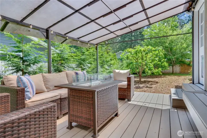 Take the steps down from the sunporch to the covered deck in the fully fenced back yard. Take the steps down from the sunporch to the covered deck in the fully fenced back yard.