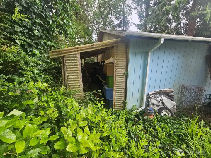Lean-to storage behind the garage. Lean-to storage behind the garage.