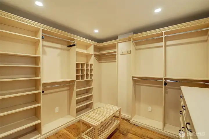 Huge primary closet with custom shelving.