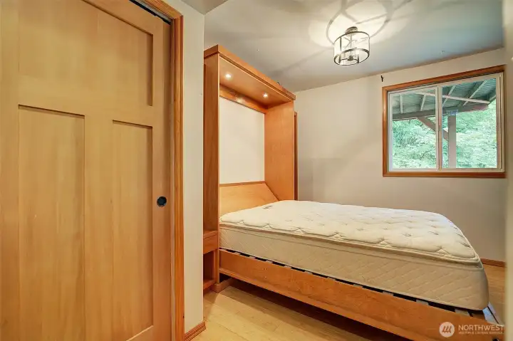Bedroom down with murphy bed. Folds up with craft table option.