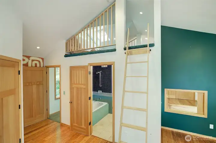Upstair bedroom with ladder to shared loft.