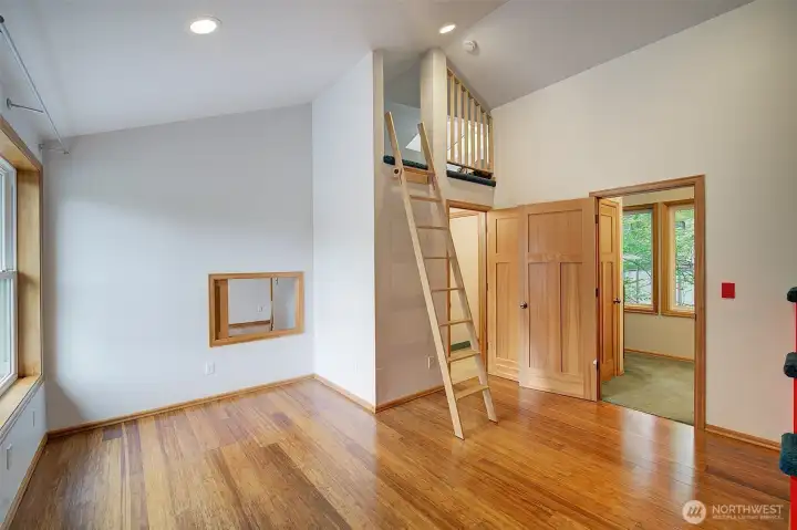 Second upstairs bedroom. Note pass-through window to the other bedroom.