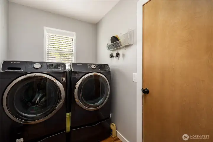 Laundry room with door to 2 car garage
