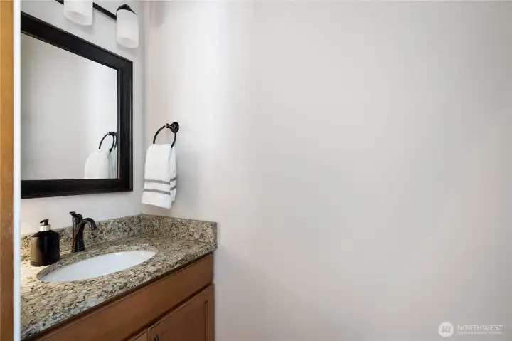 Downstairs powder room with pocket door