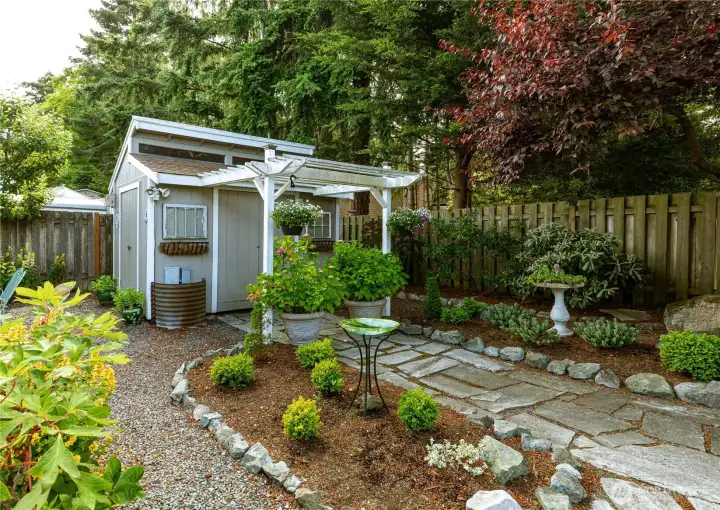 Storage shed / playhouse with slate walkways