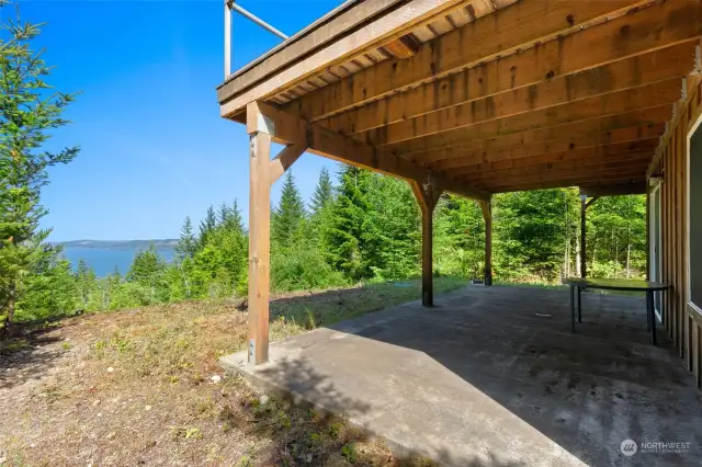 The lower level living space walks out onto a spacious covered porch that enjoys the same water view.