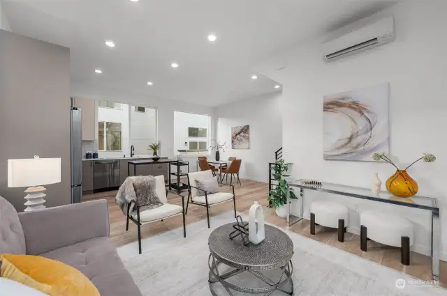 Experience seamless living with an open-concept design that flows effortlessly from the living room to the kitchen and dining area.