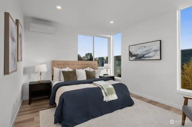 Relax and recharge in this spacious primary suite, where extensive windows frame beautiful views and the thoughtful layout ensures maximum comfort.