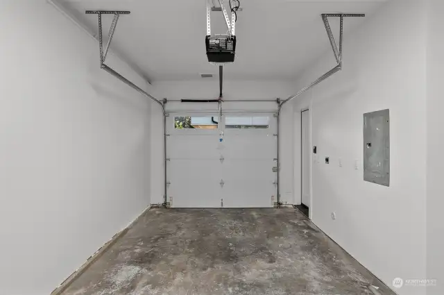 An oversized garage offers secure parking and additional storage space for all your needs.