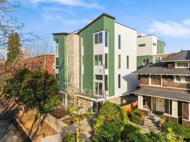 Sleek lines, timeless finishes, and natural greenery come together to create a stunning exterior for this Capitol Hill gem. This is contemporary urban living at its best.