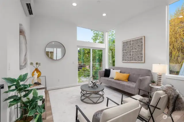 Step into a living room filled with light and serenity. Vaulted ceilings, oversized windows, and access to a private balcony create an inviting atmosphere you’ll love coming home to.