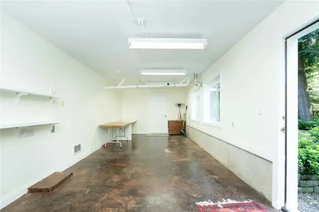 Spacious lower level finished area with exterior entrance.  Gym, Sauna, craft room, or additional living space.