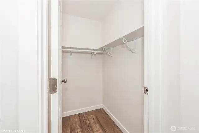 The primary suite features a large walk-in closet, providing ample space to organize your wardrobe with ease and style.