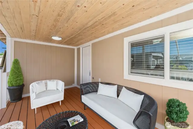 Enjoy relaxing moments on the charming outside porch—perfect for morning coffee or evening chats.