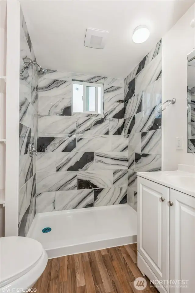 a second full bathroom with shower, providing added convenience for guests and household members.