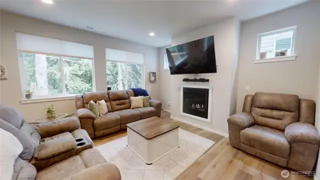 Main level living space with fireplace.
