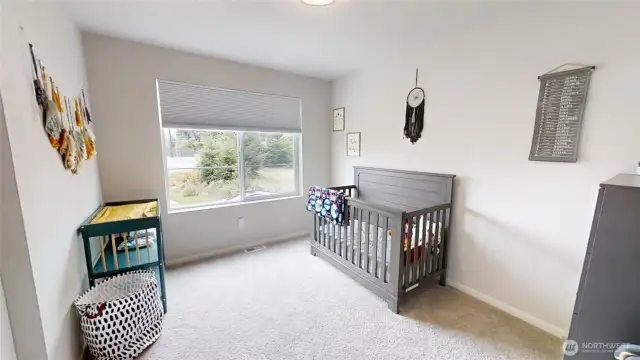 Bedroom with window towards front of home.