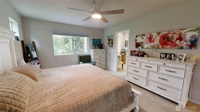 Primary bedroom with door opening to primary bathroom.