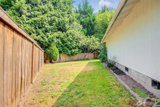 Side of the home fenced in.