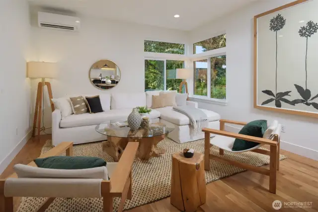 Throughout the home, high-end finishes like white oak hardwood floors, a reclaimed hickory wood floating bench, and a soft-close barn door add warmth, quality, and thoughtful design.