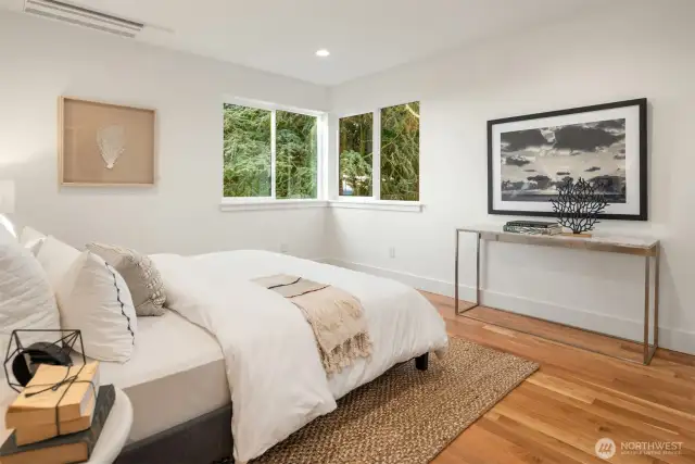 The primary bedroom on the upper level comes complete with water views!