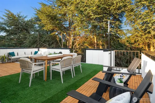 Atop it all, the expansive rooftop deck is your private outdoor oasis—complete with pet-friendly turf, real wood deck tiles, and pre-installed lighting to enjoy the panoramic views of Puget Sound, Alki Beach, the Olympic Mountains, and ferries gliding by.