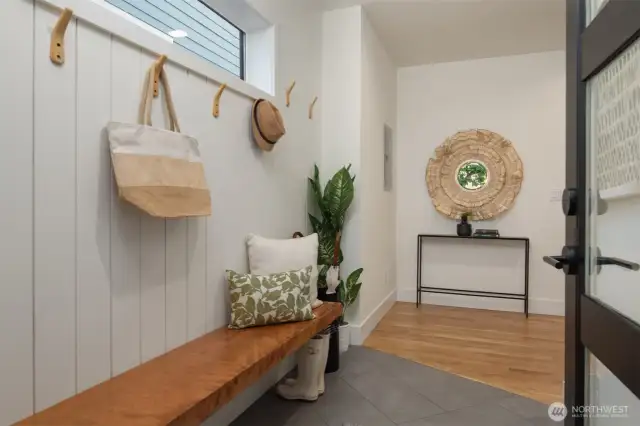 The flexible layout lives large, with two spacious bedrooms on the entry level that share a stylish Jack-and-Jill full bath—ideal for guests, roommates, or a home office setup.