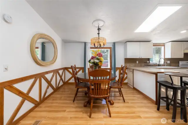Dedicated dining space has custom trim for added charm