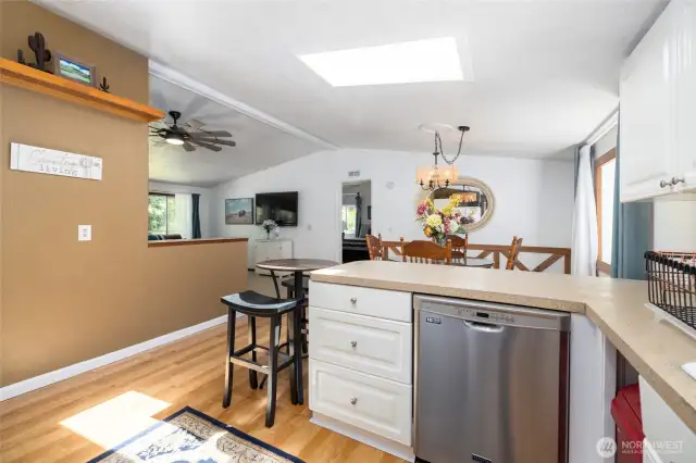 Home is light and bright with large windows and a skylight