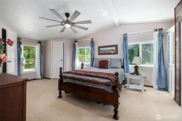 Generously sized primary bedroom has it's own ceiling fan