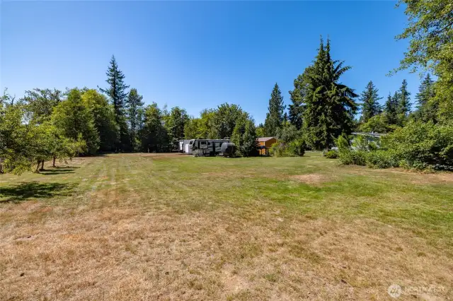 Lots of open space awaits your plans and ideas. Fruit trees can be seen on the left