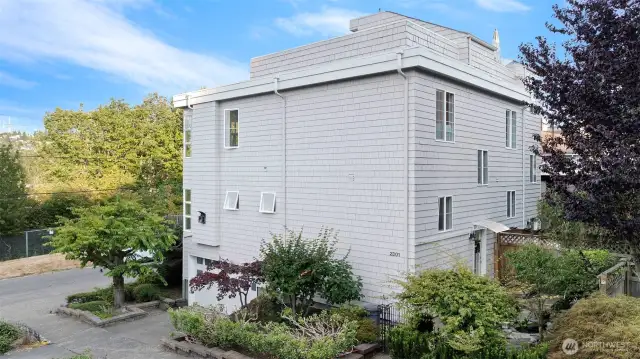 This townhome has what many do not – two living spaces, two outdoor spaces and an extra-large garage with extra off street parking.