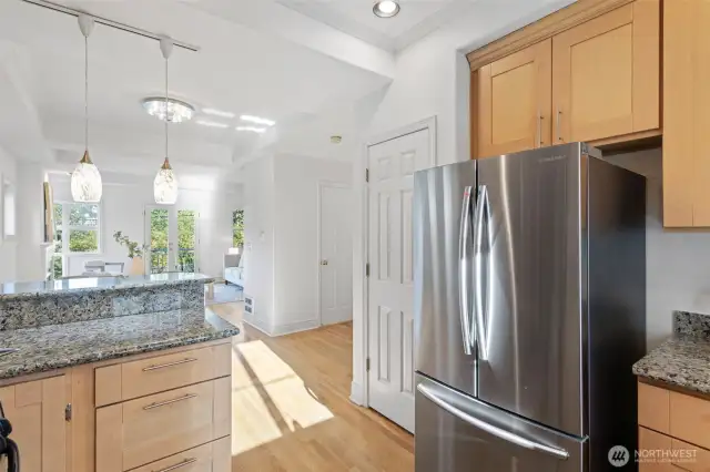 From the kitchen looking out is a wide-open floorplan with freshly painted interior.