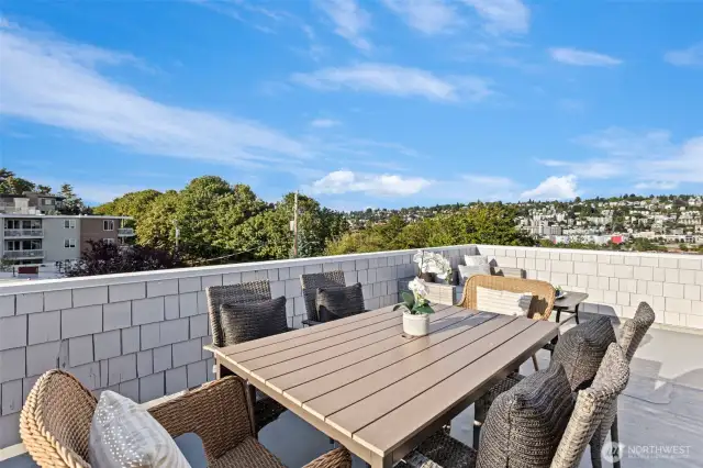 The expansive rooftop deck has views in all directions and room for both dining and living room furniture